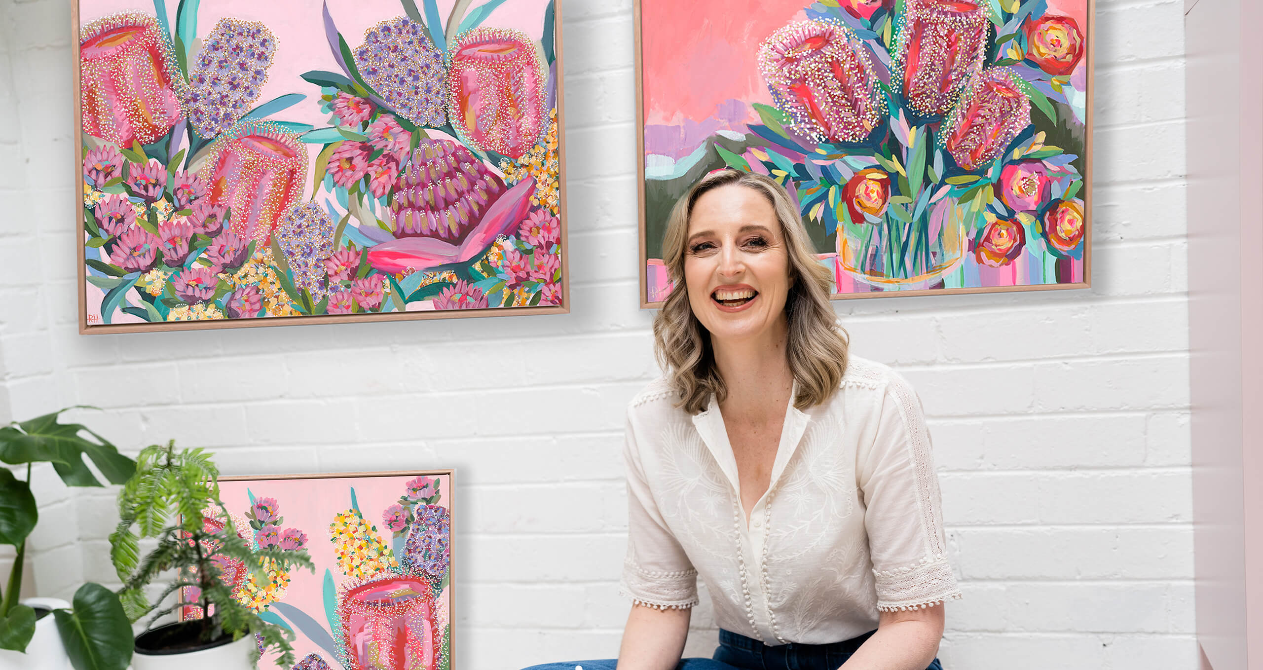 Bright floral artwork by Rachelle Holowko displayed in a light-filled interior – bold, joyful colours and modern botanical style.